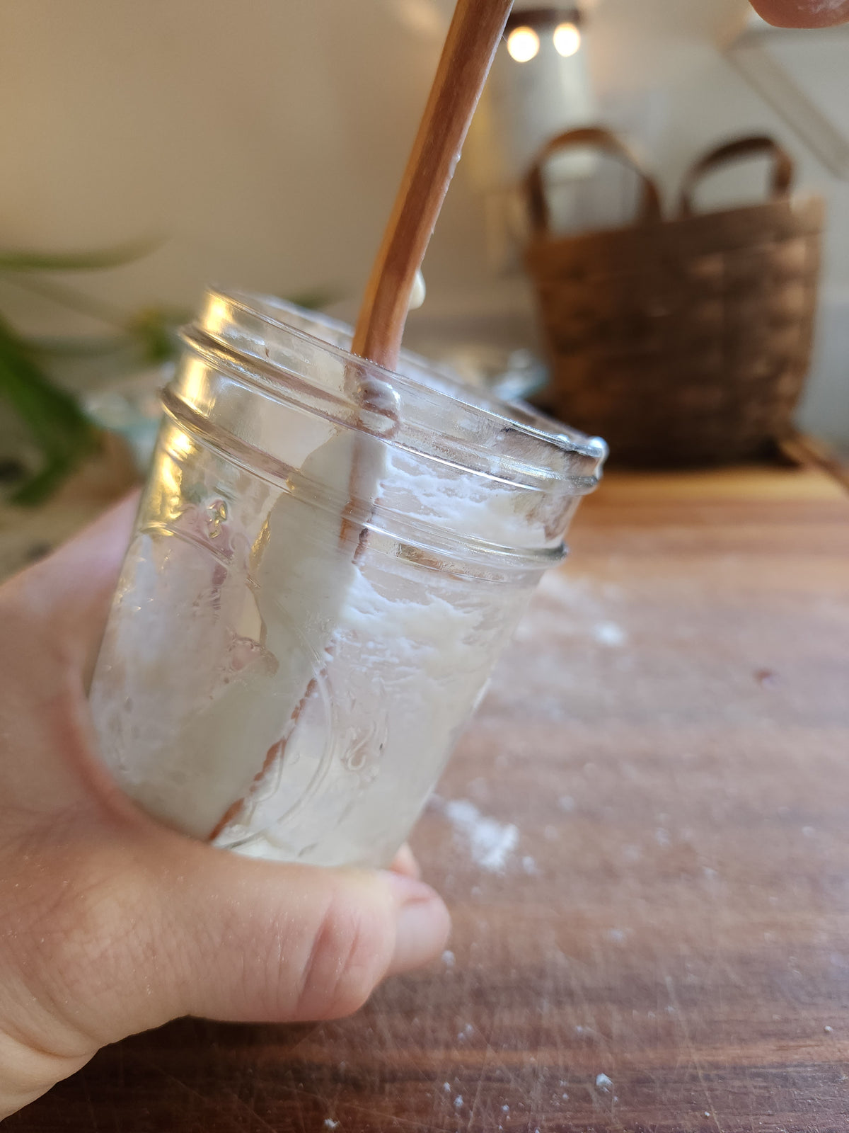 The Spatula scraping the inside wall of a starter jar