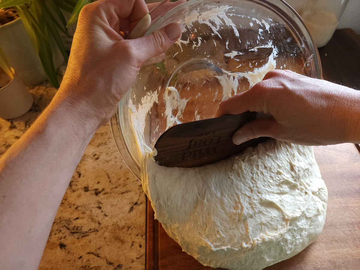 Using The Edge to clean dough from a bowl