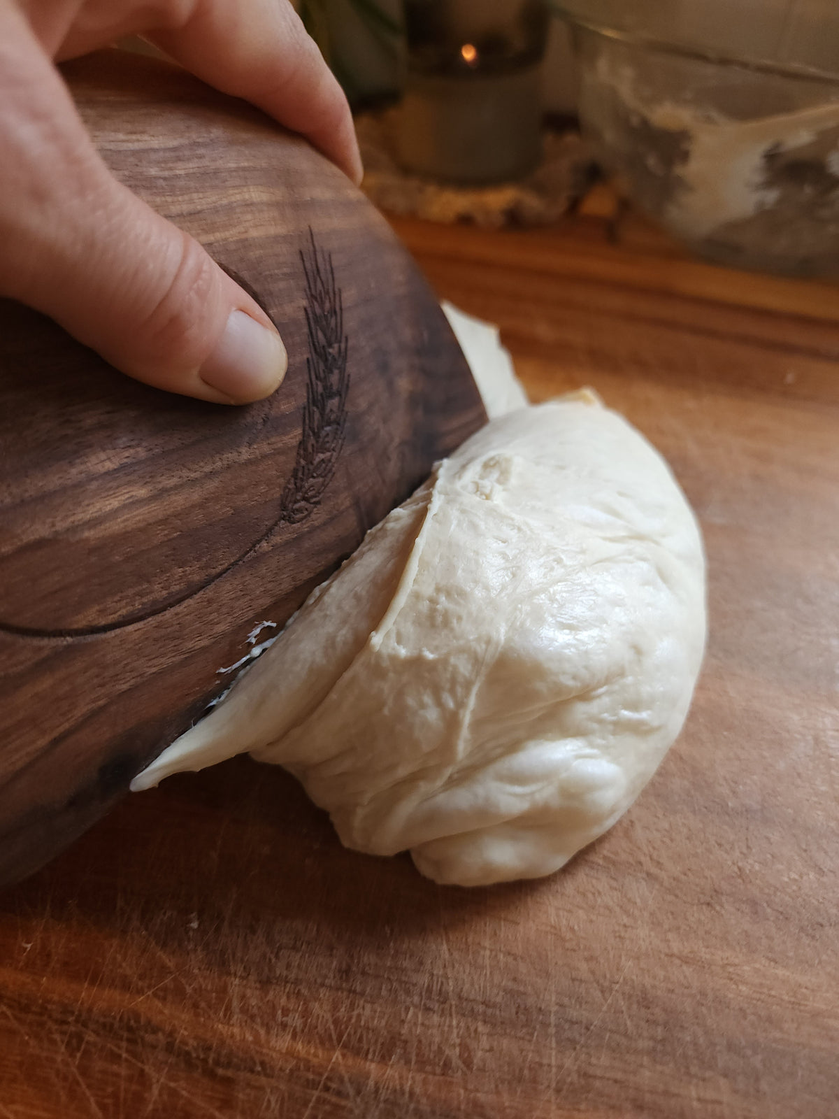 The Edge cutting a portion of dough